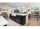 Island kitchen with granite countertops, stainless steel appliances, and farm sink at 11971 E Chevelon Trl, Gold Canyon, AZ 85118