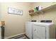 Laundry room with washer, dryer, and shelving at 11971 E Chevelon Trl, Gold Canyon, AZ 85118