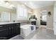 Elegant main bathroom with a soaking tub and double vanity at 11971 E Chevelon Trl, Gold Canyon, AZ 85118