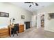 Home office with wood desk, chair, and built-in storage at 11971 E Chevelon Trl, Gold Canyon, AZ 85118