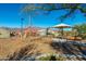 Modern playground with climbing ropes and shade structure at 11971 E Chevelon Trl, Gold Canyon, AZ 85118