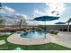 Inviting kidney-shaped pool with a waterfall feature and spacious patio at 11971 E Chevelon Trl, Gold Canyon, AZ 85118