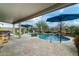 Covered patio with built-in BBQ and access to a refreshing pool at 11971 E Chevelon Trl, Gold Canyon, AZ 85118