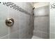 Walk-in shower with gray tile and built-in seat at 11971 E Chevelon Trl, Gold Canyon, AZ 85118