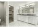 Bathroom with double vanity and a walk-in closet at 1209 N Newport St, Chandler, AZ 85225