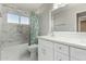 Modern bathroom with white cabinets, marble tile, and a shower/tub combo at 1209 N Newport St, Chandler, AZ 85225