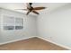 Simple bedroom with ceiling fan and window at 1209 N Newport St, Chandler, AZ 85225