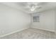 Spacious bedroom with ceiling fan, window blinds, and gray carpet at 1209 N Newport St, Chandler, AZ 85225