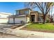 Two-story house with a two-car garage and stone accents at 1209 N Newport St, Chandler, AZ 85225