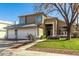 Two-story house with a landscaped yard and attached two-car garage at 1209 N Newport St, Chandler, AZ 85225