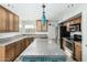 Kitchen with wood cabinets, granite countertops and island at 1209 N Newport St, Chandler, AZ 85225