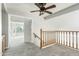 Upstairs hallway with carpet and access to bedrooms at 1209 N Newport St, Chandler, AZ 85225