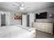 Spacious bedroom features neutral decor, and an ensuite bathroom with an organized walk-in closet at 12378 W Roma Ave, Avondale, AZ 85392