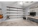 Bedroom offering custom wall shelving and a large desk area, perfect for working from home at 12378 W Roma Ave, Avondale, AZ 85392