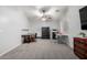 Versatile bonus room with desk and table, suitable for a home office or entertainment area at 12378 W Roma Ave, Avondale, AZ 85392