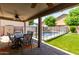 Inviting covered patio with ceiling fans, offering views of the backyard pool at 12378 W Roma Ave, Avondale, AZ 85392