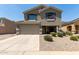 Charming two-story home featuring a two-car garage and a welcoming front porch at 12378 W Roma Ave, Avondale, AZ 85392