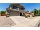 Charming two-story home featuring a two-car garage and a welcoming front porch at 12378 W Roma Ave, Avondale, AZ 85392