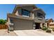 Charming two-story home featuring a two-car garage and a welcoming front porch at 12378 W Roma Ave, Avondale, AZ 85392