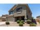 Charming two-story home featuring a two-car garage and a welcoming front porch at 12378 W Roma Ave, Avondale, AZ 85392