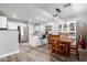 Bright kitchen with a large island, stainless steel appliances, and adjacent dining area at 12378 W Roma Ave, Avondale, AZ 85392