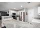 Open-concept kitchen with granite countertops, stainless steel appliances and a spacious pantry at 12378 W Roma Ave, Avondale, AZ 85392