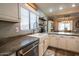 Bright kitchen with a large sink and granite countertops at 12378 W Roma Ave, Avondale, AZ 85392