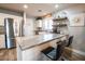 Well-lit kitchen with countertops and stainless steel appliances at 12378 W Roma Ave, Avondale, AZ 85392