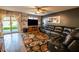 Inviting living room with plush leather seating and sliding doors at 12378 W Roma Ave, Avondale, AZ 85392