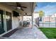 Covered patio with outdoor furniture and access to the pool area at 12378 W Roma Ave, Avondale, AZ 85392