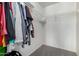 Bright walk-in closet featuring wire shelving and space for ample storage solutions at 12378 W Roma Ave, Avondale, AZ 85392