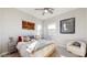 Guest bedroom with a king bed and ceiling fan at 13360 W Red Hawk Dr, Peoria, AZ 85383