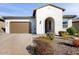 Single-story home with a two-car garage and landscaped front yard at 13360 W Red Hawk Dr, Peoria, AZ 85383