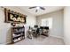 Home office featuring a desk, bookcase, and multiple monitors at 13360 W Red Hawk Dr, Peoria, AZ 85383