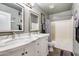 Bathroom with double vanity and a bathtub at 14206 W Mandalay Ln, Surprise, AZ 85379