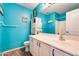 Bathroom with teal walls and a spacious vanity at 14206 W Mandalay Ln, Surprise, AZ 85379