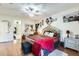 Main bedroom with king bed, fireplace, and hardwood floors at 14206 W Mandalay Ln, Surprise, AZ 85379