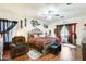 Elegant main bedroom with a king-size bed and hardwood floors at 14206 W Mandalay Ln, Surprise, AZ 85379