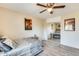 Well lit bedroom with a full-size bed and mirrored closet doors at 14206 W Mandalay Ln, Surprise, AZ 85379