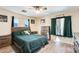 Spacious bedroom with a queen bed and built-in dresser at 14206 W Mandalay Ln, Surprise, AZ 85379