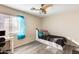 Bright bedroom with built-in drawers and a workspace at 14206 W Mandalay Ln, Surprise, AZ 85379