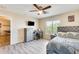 Bedroom with a queen bed, dresser, and desk at 14206 W Mandalay Ln, Surprise, AZ 85379