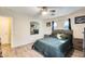 Bedroom with queen bed, dresser, and large mirror at 14206 W Mandalay Ln, Surprise, AZ 85379