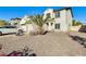 Landscaped front yard with gravel and a palm tree at 14206 W Mandalay Ln, Surprise, AZ 85379