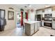 Modern kitchen with stainless steel appliances and an island at 14206 W Mandalay Ln, Surprise, AZ 85379