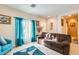 Living room with teal accents and a brown couch at 14206 W Mandalay Ln, Surprise, AZ 85379