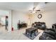 Living room with black leather reclining sofas and coffee table at 14206 W Mandalay Ln, Surprise, AZ 85379