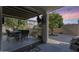 Covered patio with seating area and view of yard at 14206 W Mandalay Ln, Surprise, AZ 85379