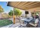 Covered patio with dining furniture, ideal for outdoor entertaining at 14206 W Mandalay Ln, Surprise, AZ 85379