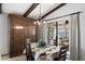 Dining area with built-in hutch, table for four, and sunroom access at 1498 Leisure World --, Mesa, AZ 85206